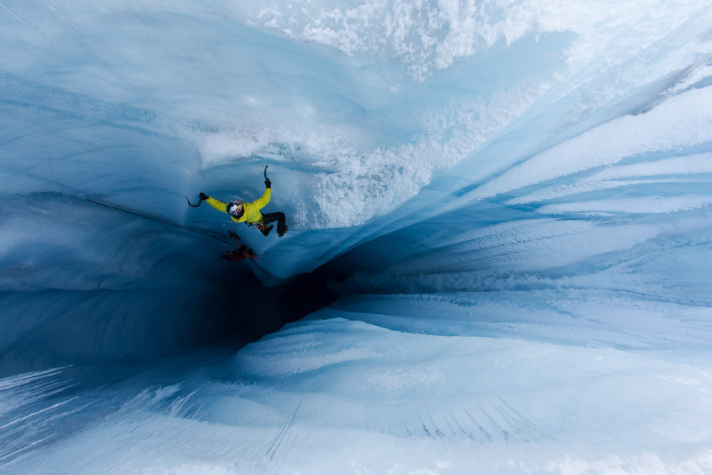 Will Gadd ice climbs in a moulin on the Greenland ice cap near Ilulissat, Greenland on August 26, 2018.